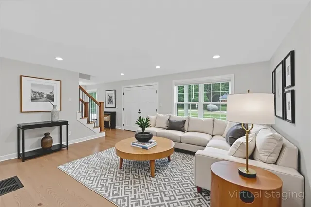 a living room with furniture and a table