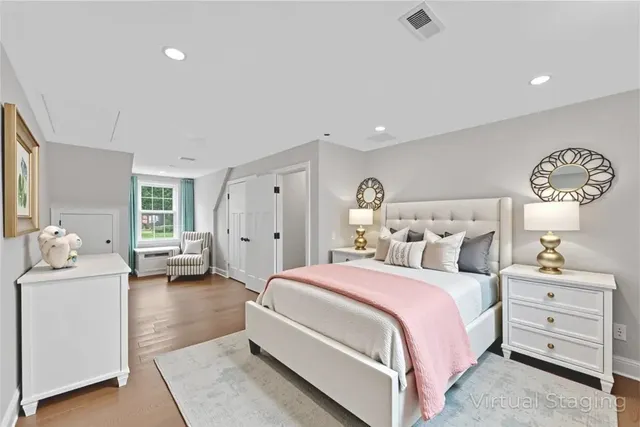 a bedroom with a bed and a couch