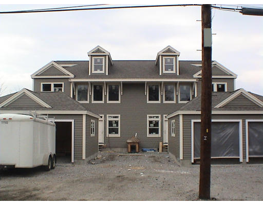 52 Crescent Road, Unit 52 Needham, MA 02494 - Photo 2 of 5 a front view of a house with a yard