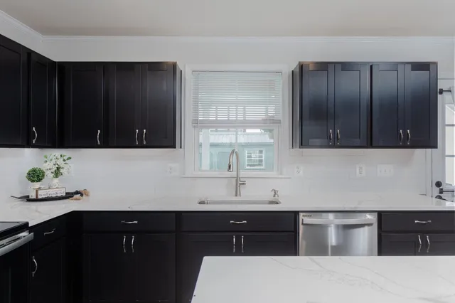 a living room with furniture and a dresser