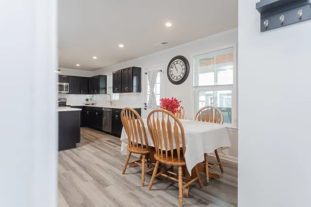 wooden floor with window in closet and window