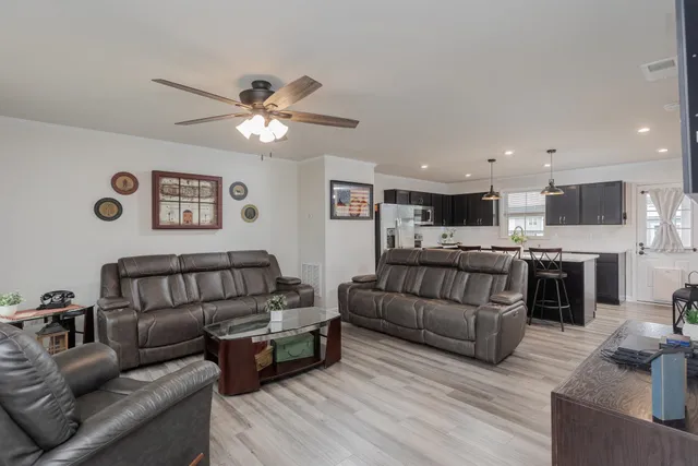a kitchen with a sink and a stove top oven