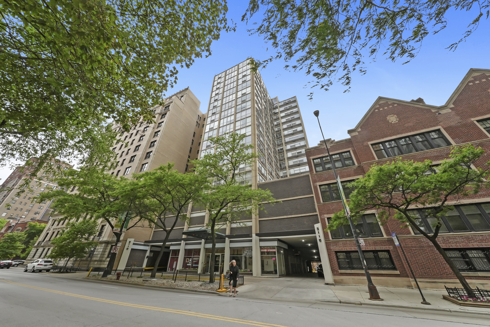 front view of a building with a garden