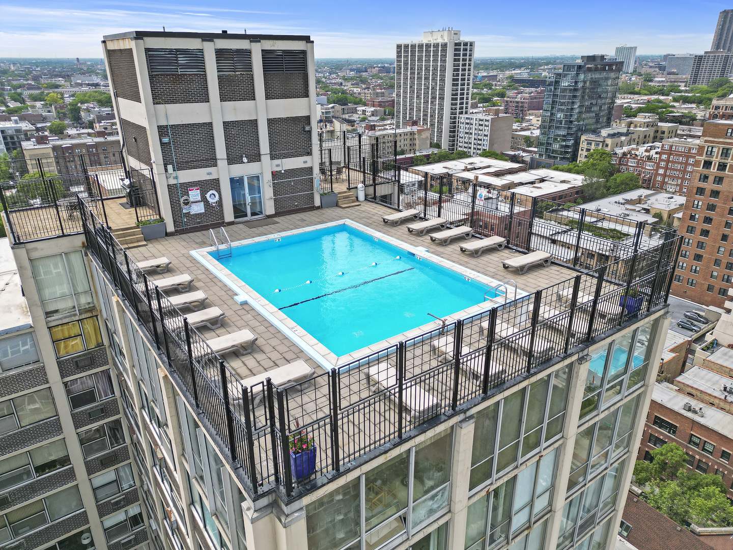 3110 North Sheridan Road, Unit 1207 Chicago, IL 60657 - Photo 27 of 32 a view of a balcony with two chairs and a deck