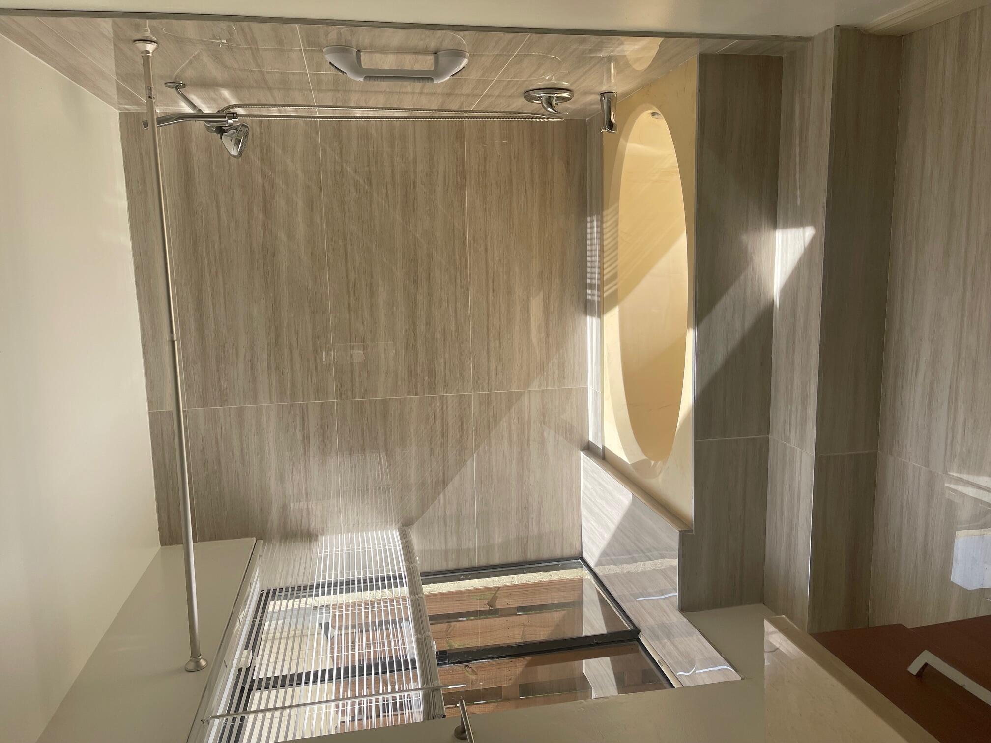 641 Executive Center Drive, Unit P105 West Palm Beach, FL 33401 - Photo 11 of 21 a bathroom with a shower