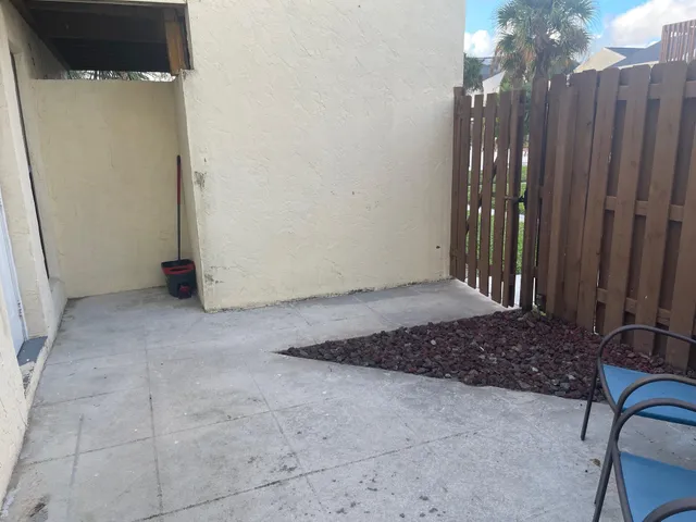 a view of a livingroom with furniture and a window