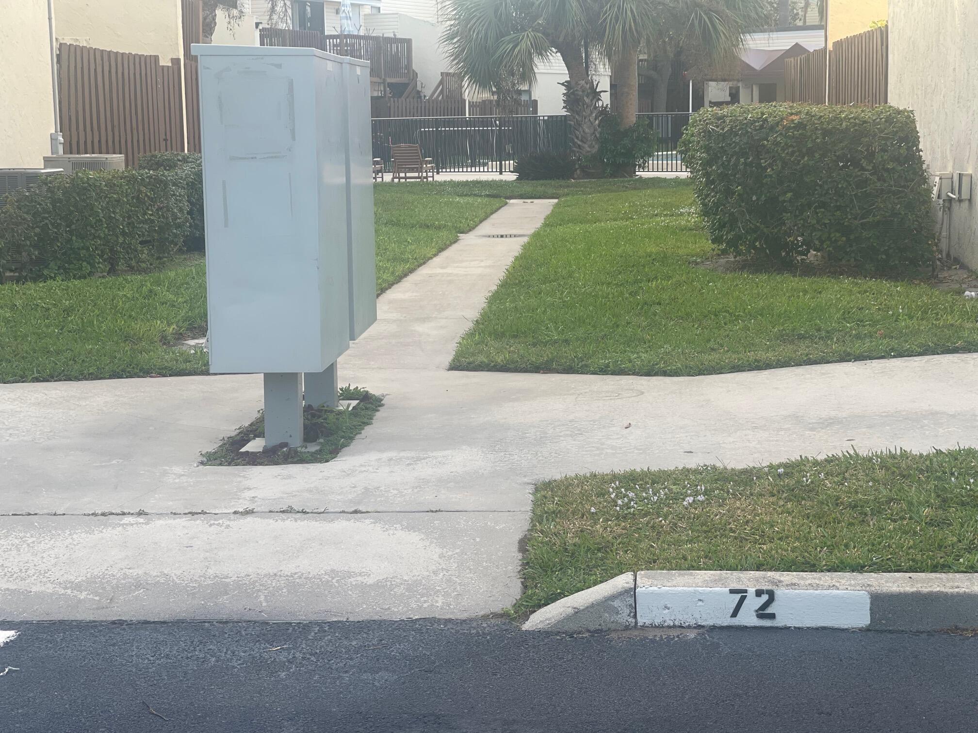 641 Executive Center Drive, Unit P105 West Palm Beach, FL 33401 - Photo 18 of 21 a view of a street with a houses