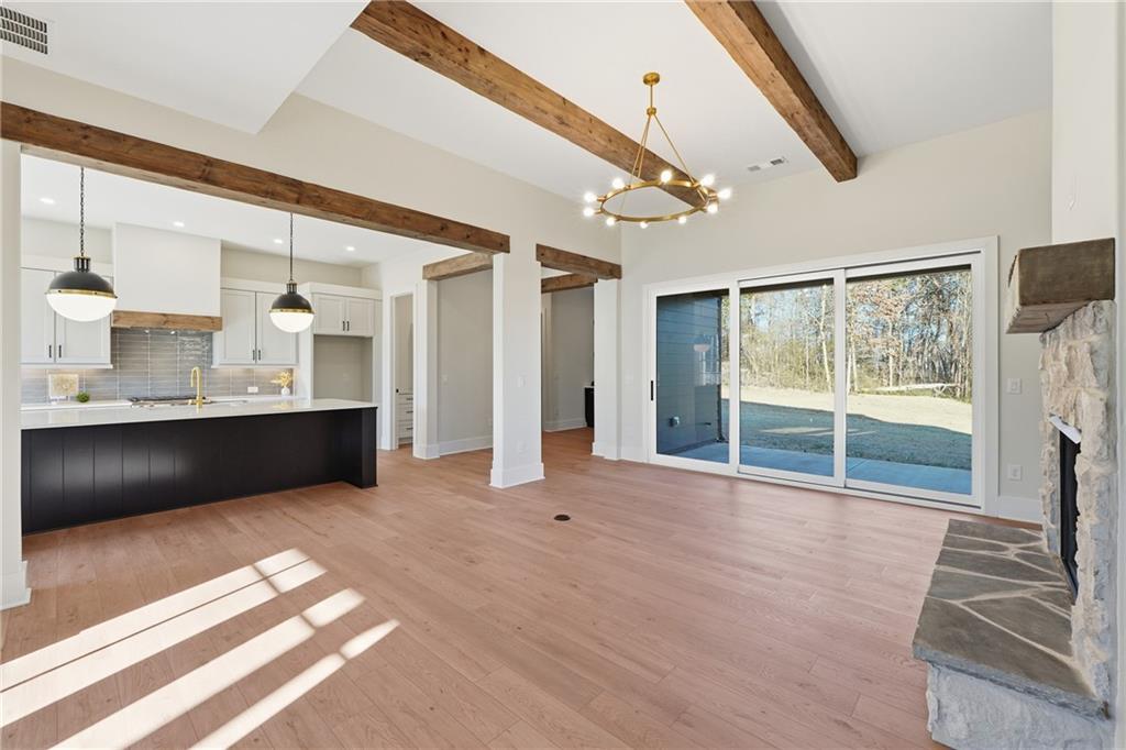 157 Palisade Drive Rydal, GA 30171 - Photo 23 of 68 a view of an empty room with a fireplace and a window