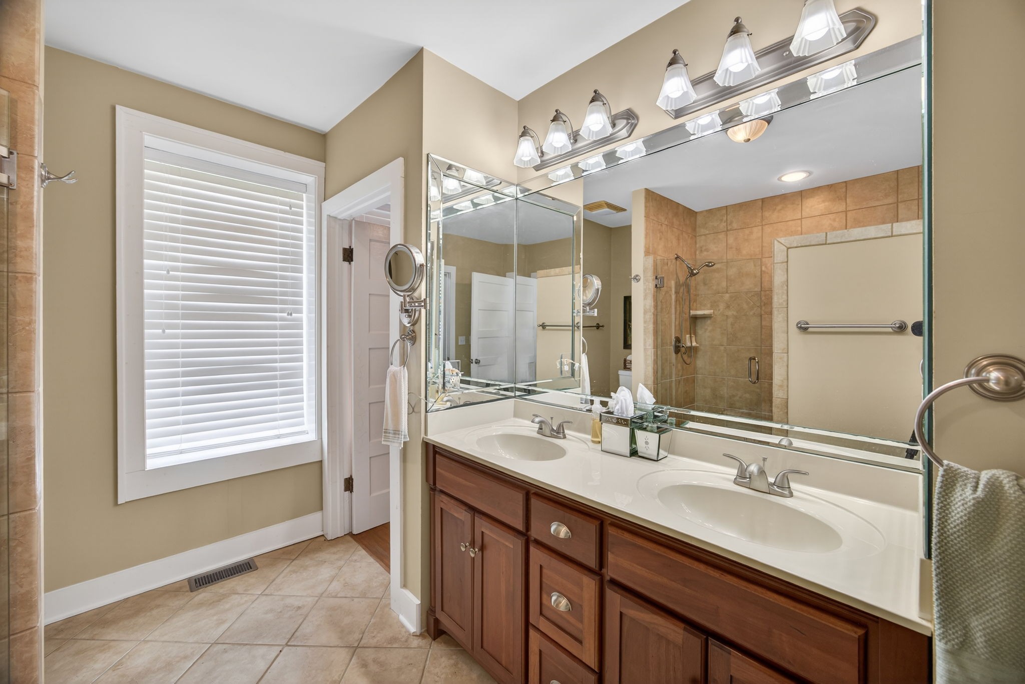 1385 Mitchell Street Celina, TN 38551 - Photo 16 of 35 a bathroom with a sink double vanity and a mirror