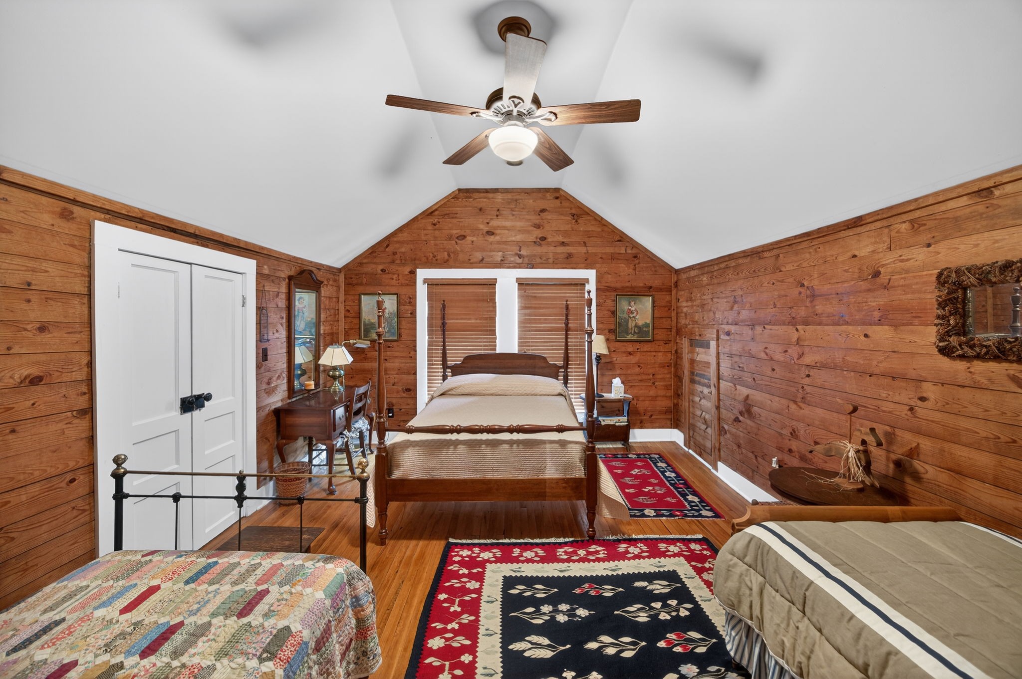 1385 Mitchell Street Celina, TN 38551 - Photo 21 of 35 a bedroom with a bed and a chandelier