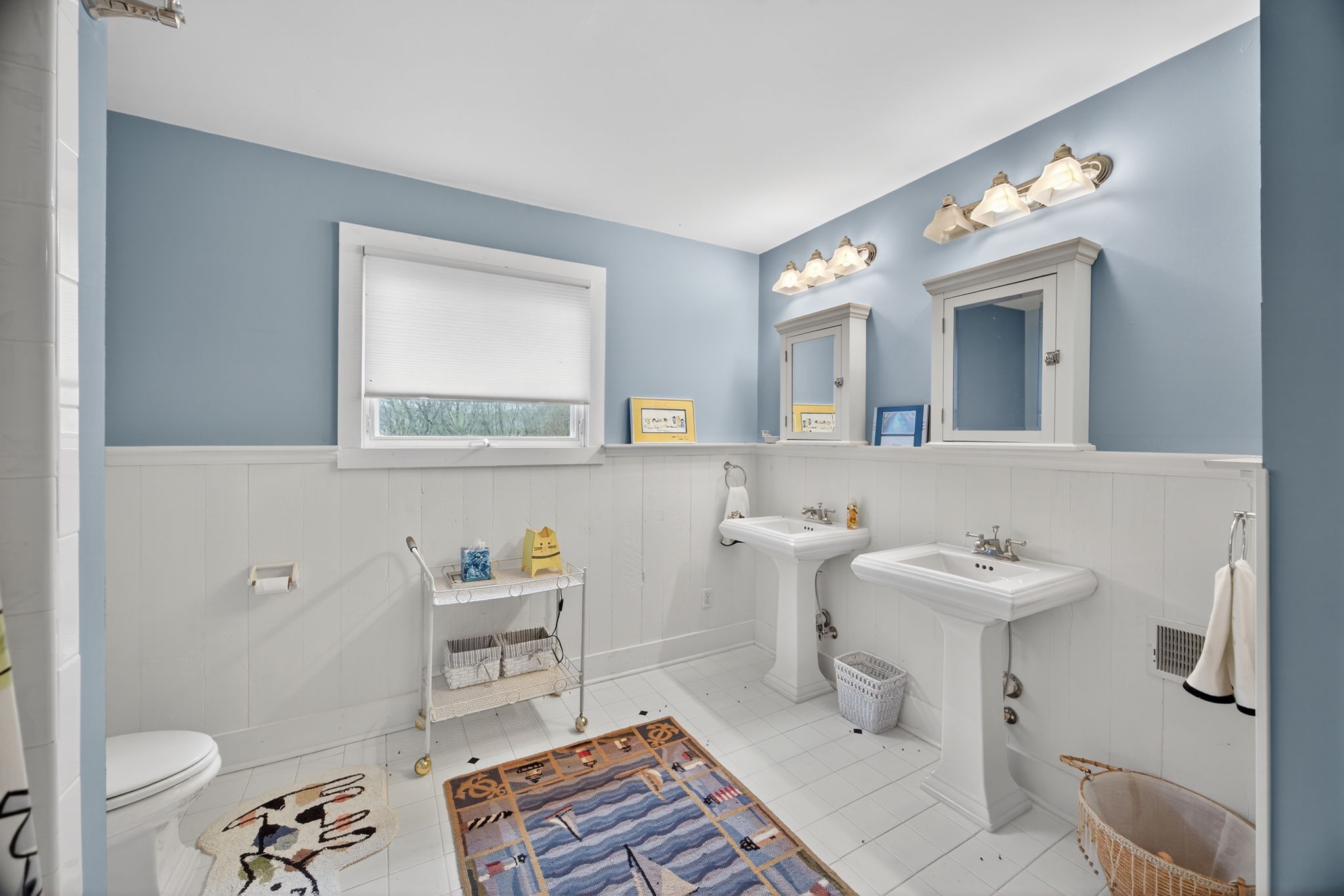 1385 Mitchell Street Celina, TN 38551 - Photo 23 of 35 a bathroom with a sink toilet a mirror and shower