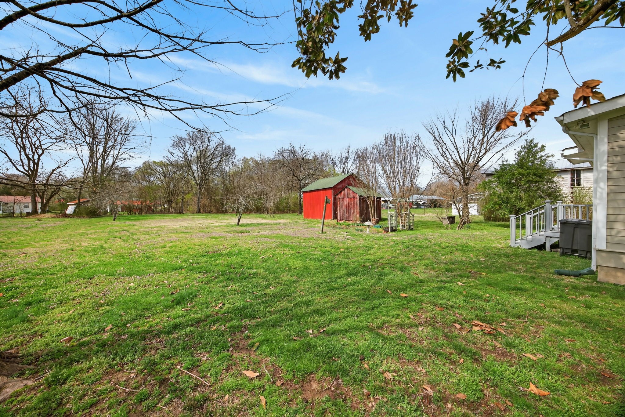 1385 Mitchell Street Celina, TN 38551 - Photo 25 of 35 a view of an house with backyard space and tree