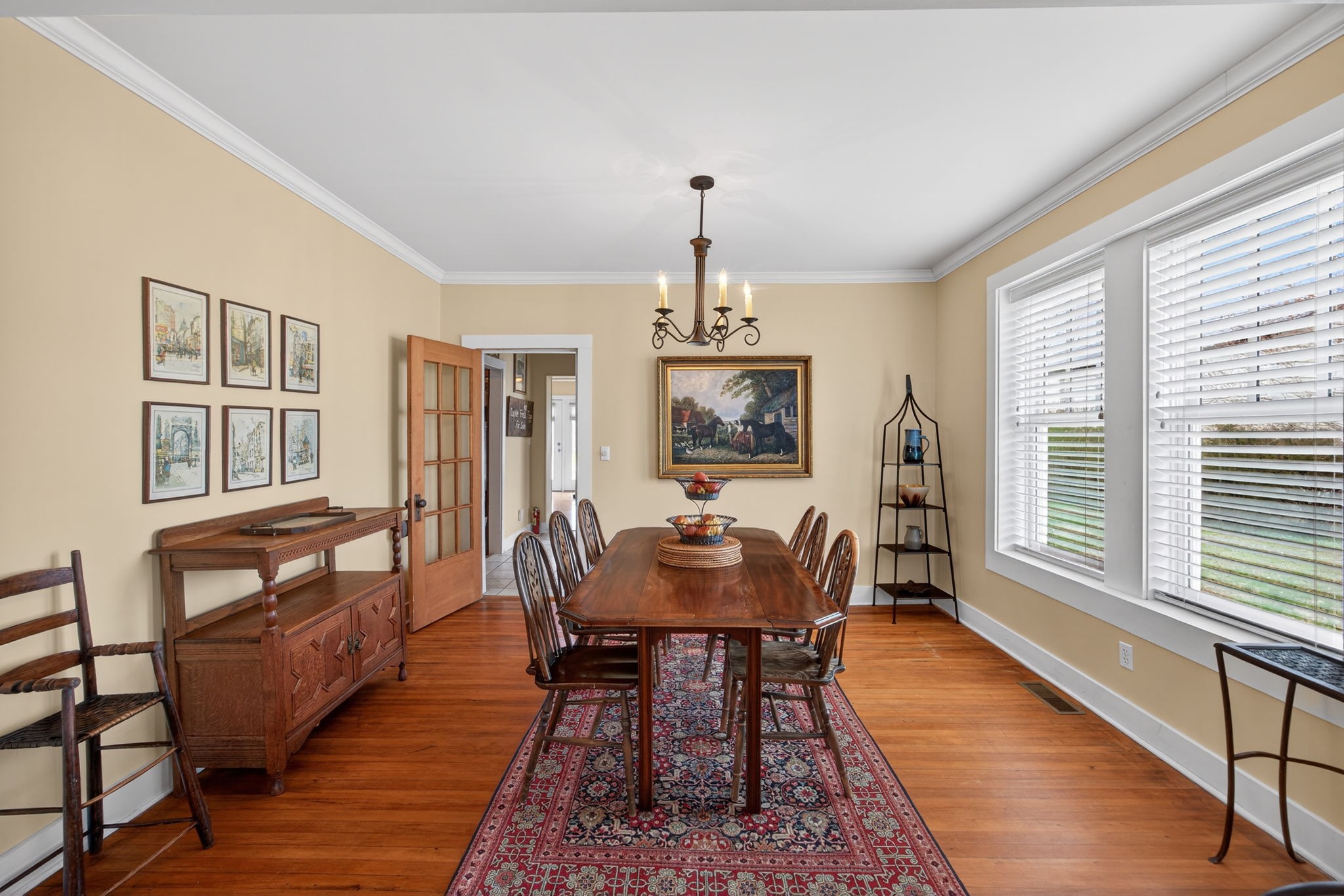 1385 Mitchell Street Celina, TN 38551 - Photo 6 of 35 a dining room with furniture a chandelier and wooden floor