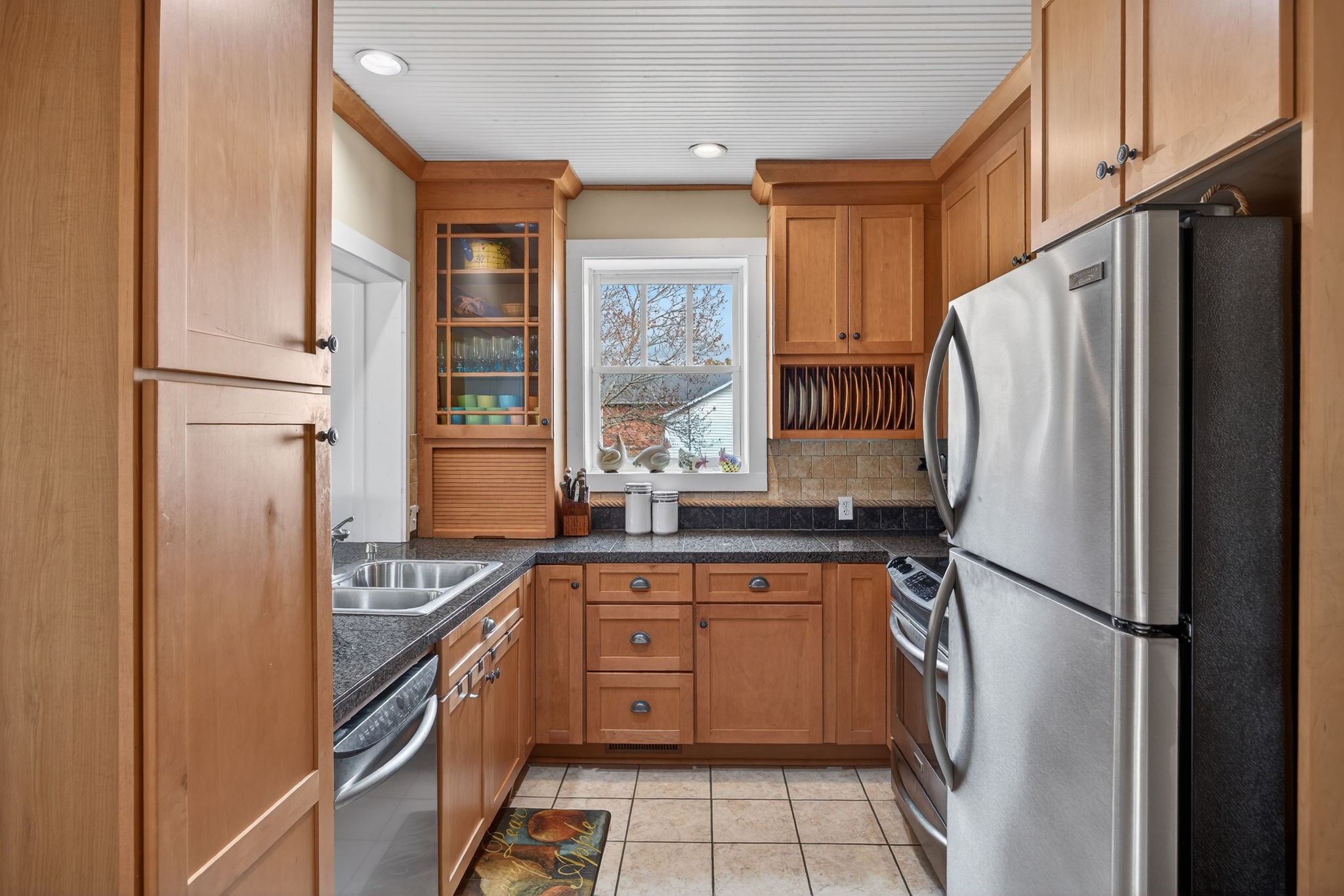 1385 Mitchell Street Celina, TN 38551 - Photo 7 of 35 a kitchen with stainless steel appliances granite countertop a refrigerator and a sink
