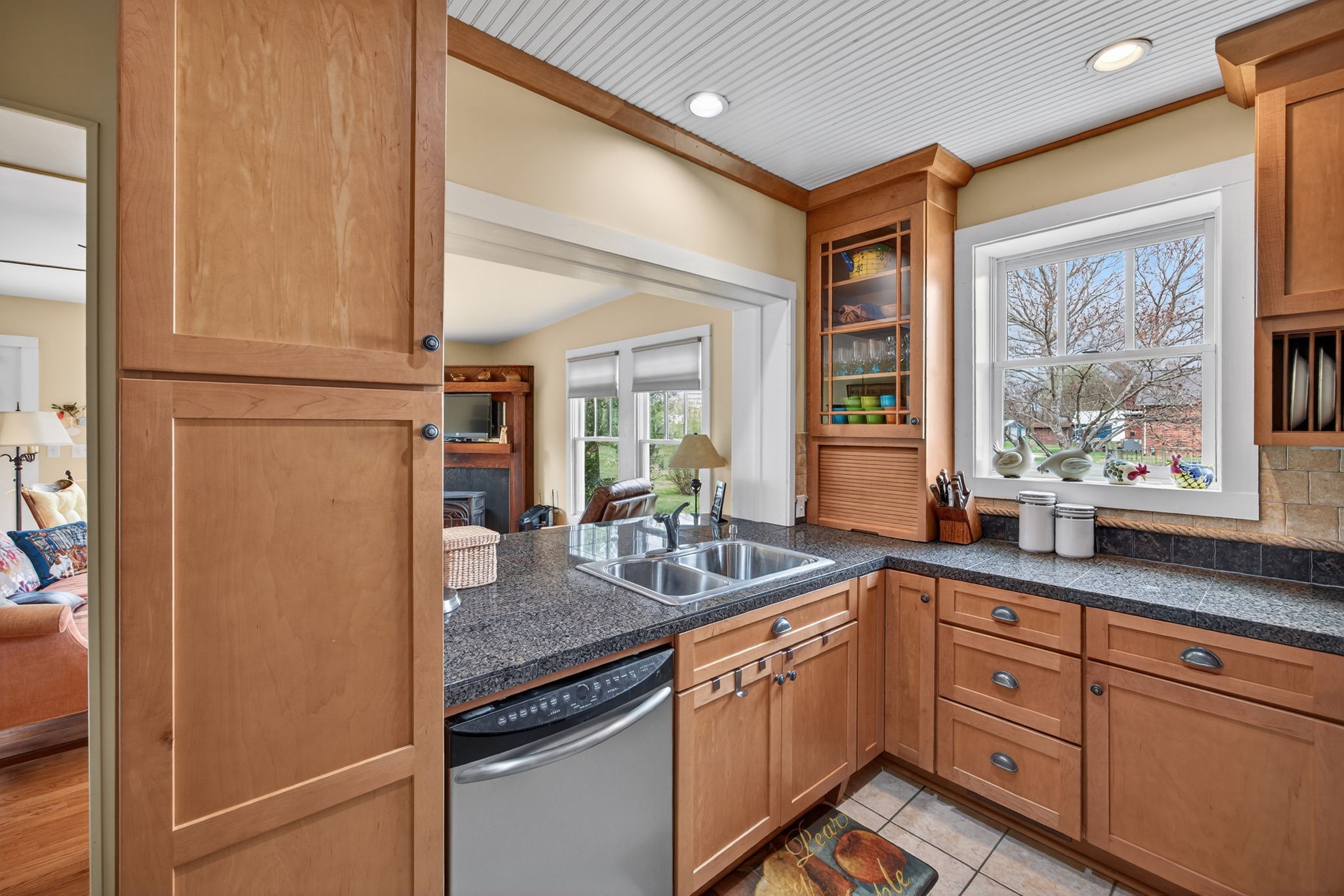 1385 Mitchell Street Celina, TN 38551 - Photo 8 of 35 a kitchen with granite countertop stainless steel appliances a sink and large window