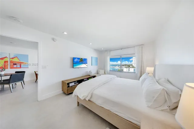 a bedroom with a bed and a table