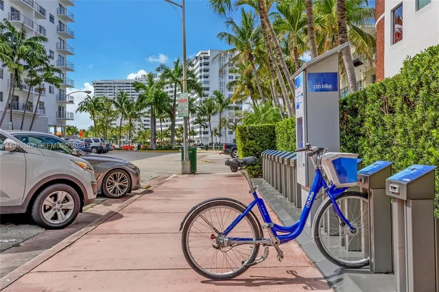 a table and chairs sitting in front of a lake