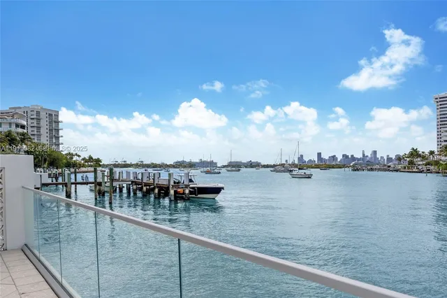 a view of swimming pool with outdoor seating and city view