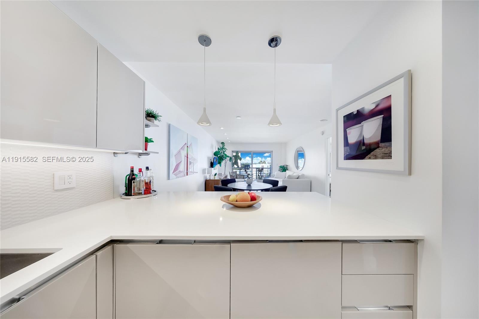 1450 Lincoln Road, Unit 1003 Miami Beach, FL 33139 - Photo 8 of 27 a view of a kitchen with a sink and cabinets