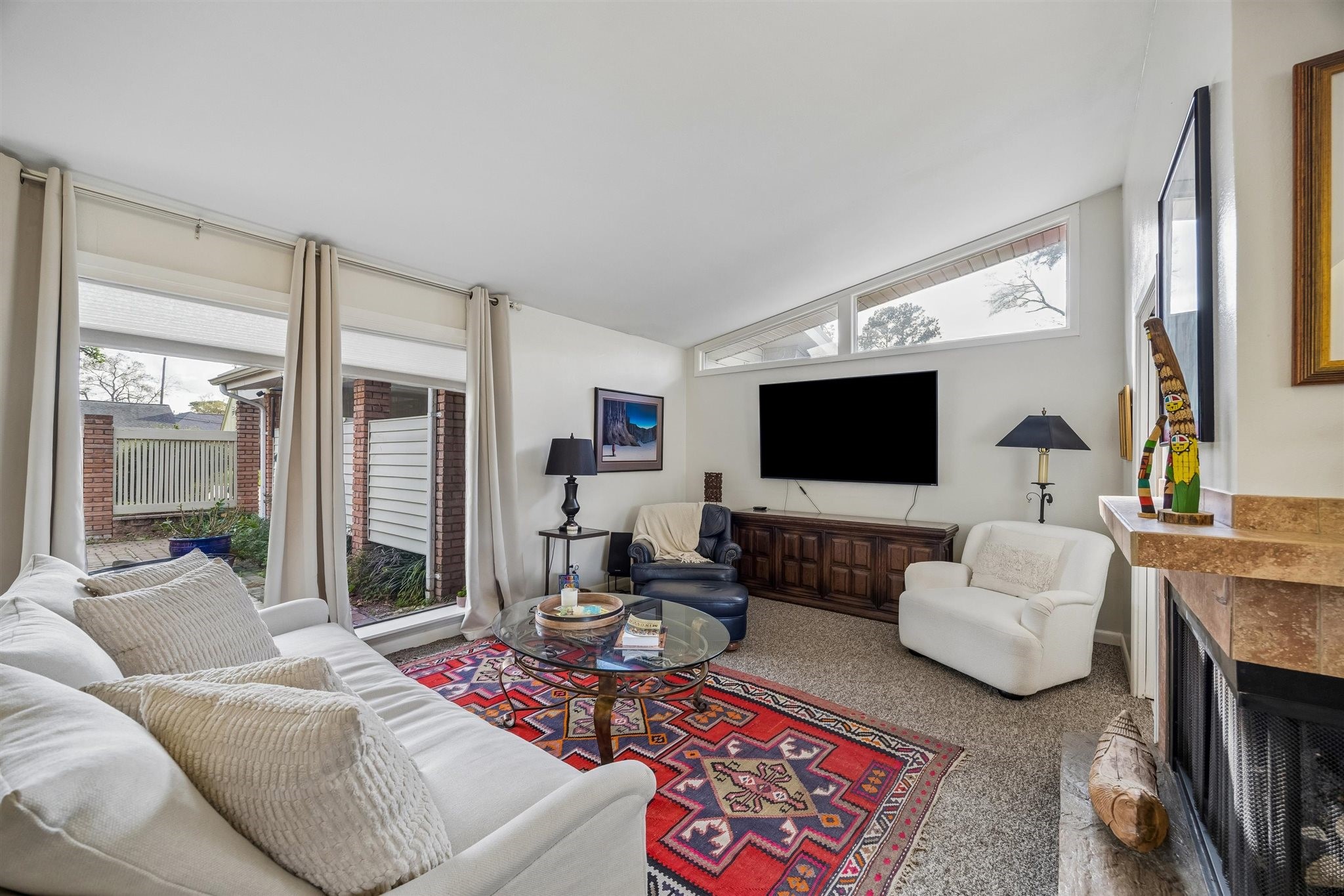 10226 Ivyridge Road Houston, TX 77043 - Photo 29 of 37 a living room with furniture and a flat screen tv