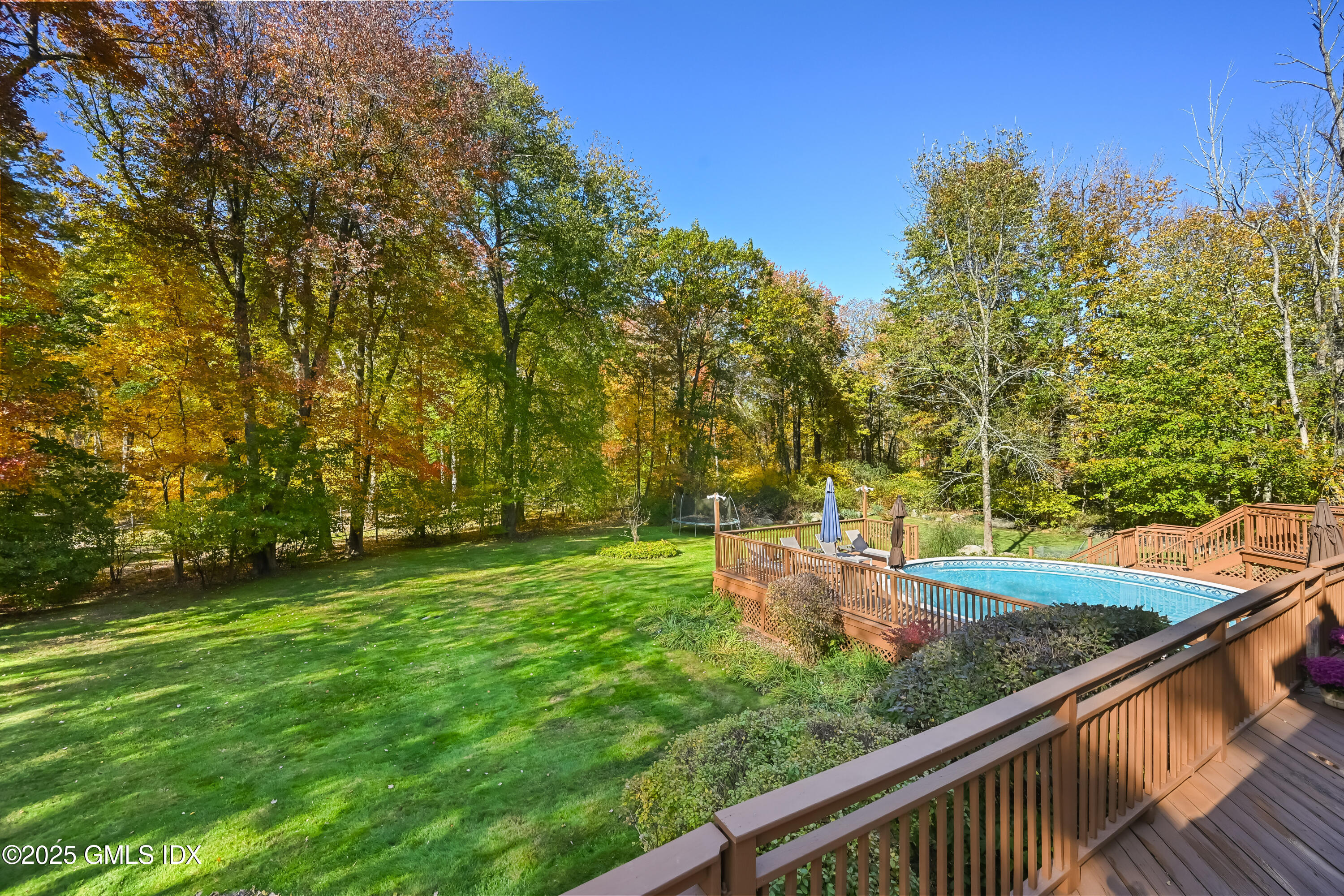 38 Bedford Road Greenwich, CT 06831 - Photo 2 of 32 a view of a backyard with large trees