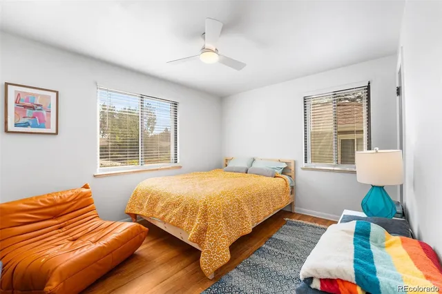 a bedroom with two beds and a window