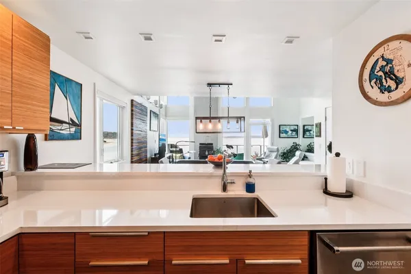 a view of a kitchen with a sink and a stove