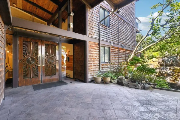 a view of a building with potted plants