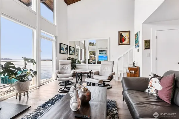 a living room with furniture or couch and a potted plant