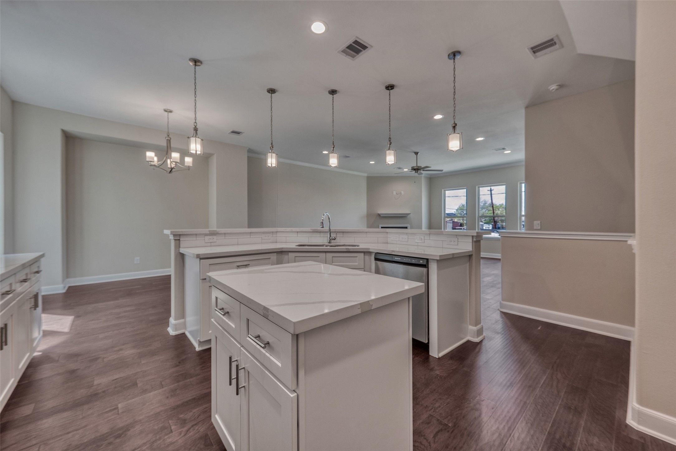 4135 Du Pont Street Houston, TX 77021 - Photo 13 of 30 a kitchen with a sink a center island a counter space and a refrigerator