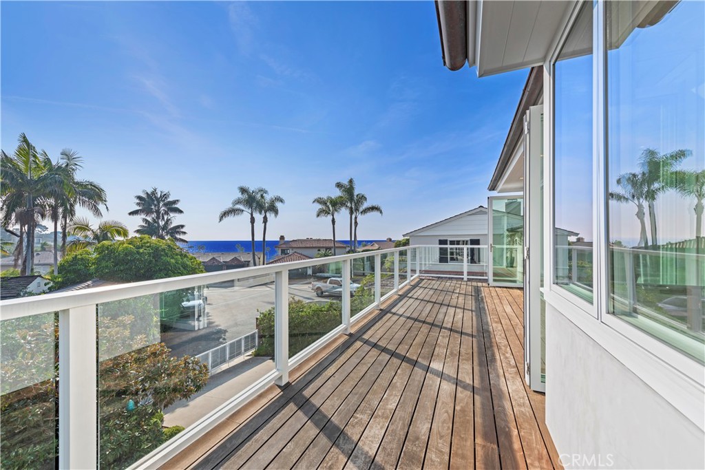 219 Emerald Bay Laguna Beach, CA 92651 - Photo 25 of 52 a view of balcony with wooden floor and seating space