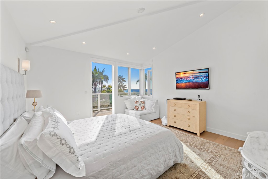 219 Emerald Bay Laguna Beach, CA 92651 - Photo 26 of 52 a bedroom with a bed and a large window