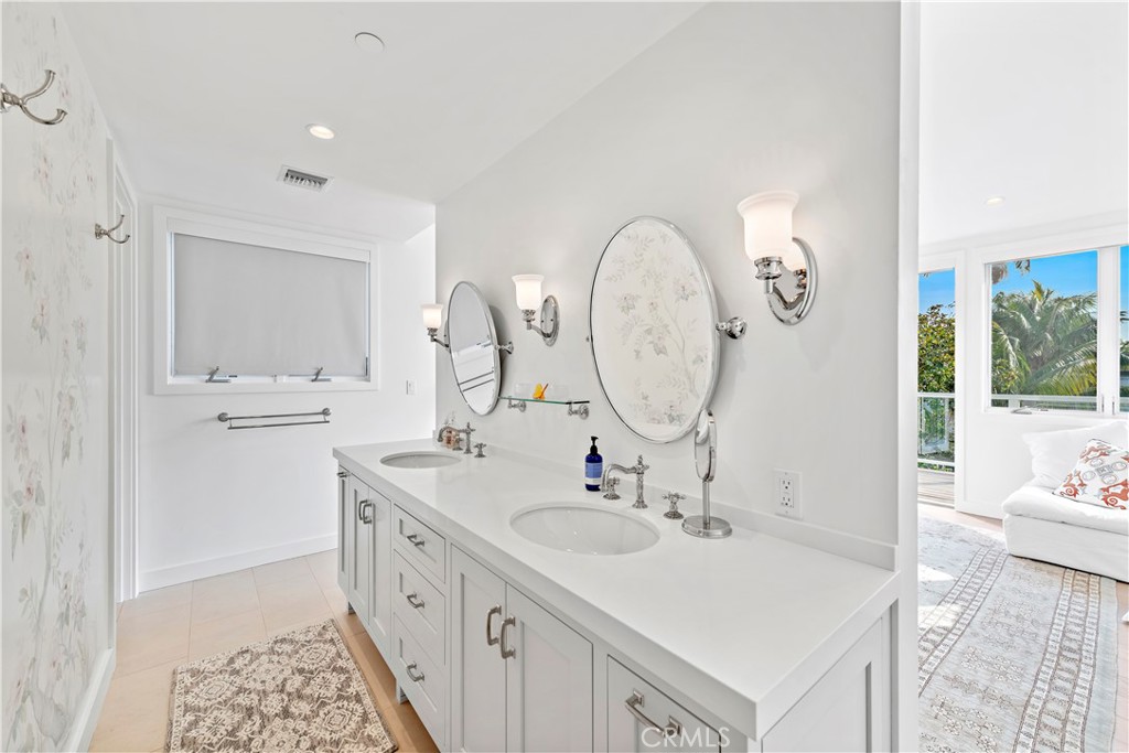 219 Emerald Bay Laguna Beach, CA 92651 - Photo 29 of 52 a bathroom with a sink double vanity and a mirror