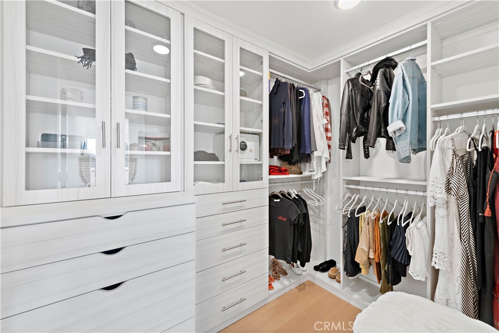 219 Emerald Bay Laguna Beach, CA 92651 - Photo 32 of 52 a view of walk in closet with clothes and shoes