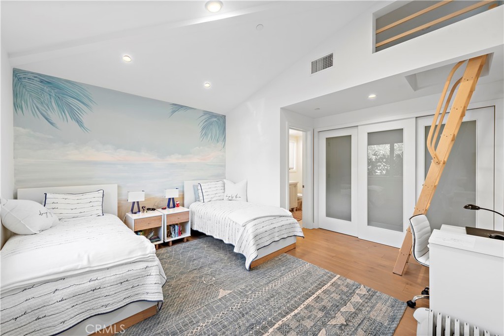 219 Emerald Bay Laguna Beach, CA 92651 - Photo 35 of 52 a spacious bedroom with a bed and a couch