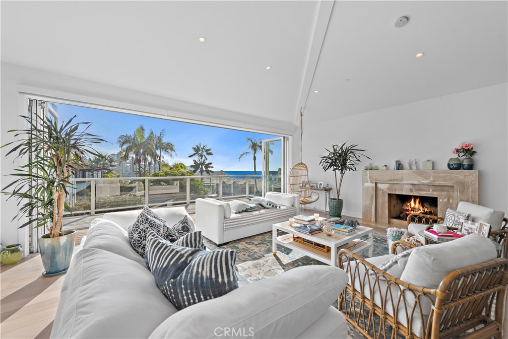 219 Emerald Bay Laguna Beach, CA 92651 - Photo 4 of 52 a living room with furniture and a floor to ceiling window