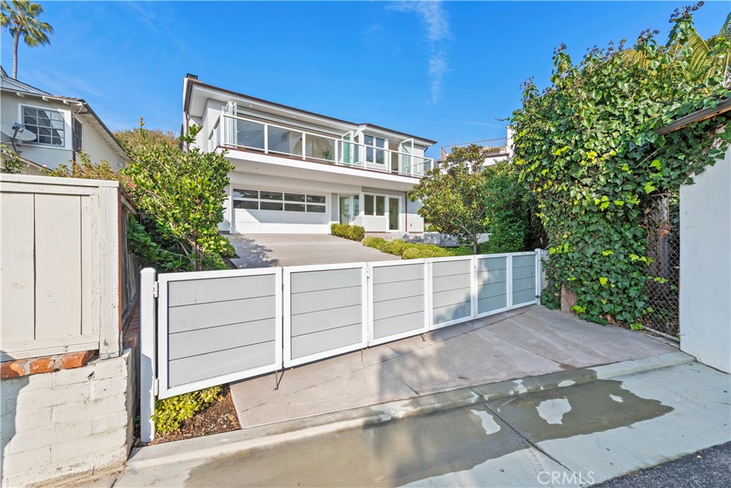 219 Emerald Bay Laguna Beach, CA 92651 - Photo 44 of 52 a view of a house with a small yard and large tree