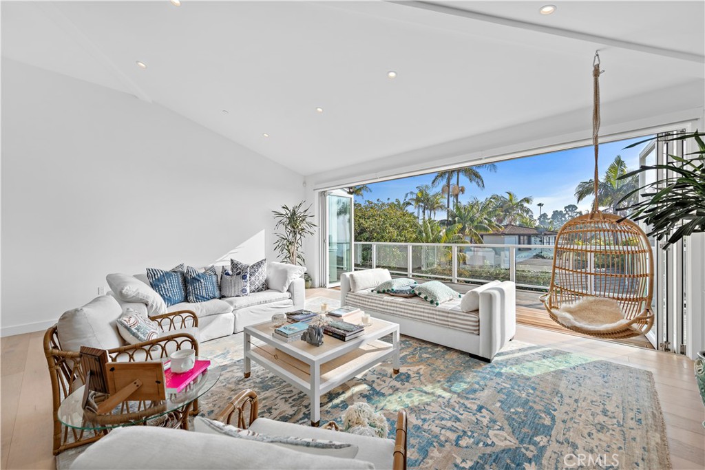 219 Emerald Bay Laguna Beach, CA 92651 - Photo 5 of 52 a living room with furniture and a floor to ceiling window
