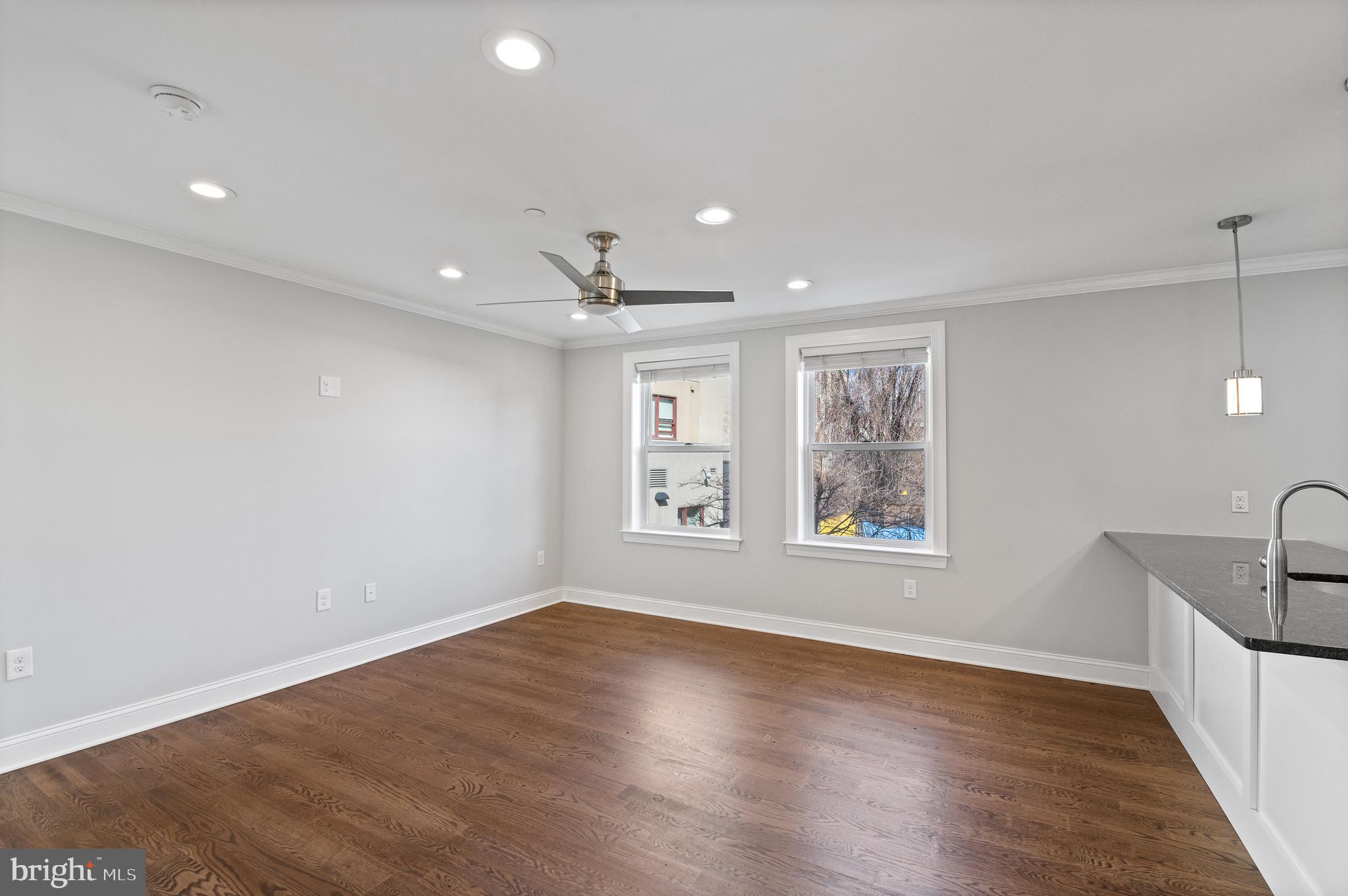 988 North Marshall Street, Unit 2R Philadelphia, PA 19123 - Photo 15 of 29 a view of an empty room with wooden floor and a window