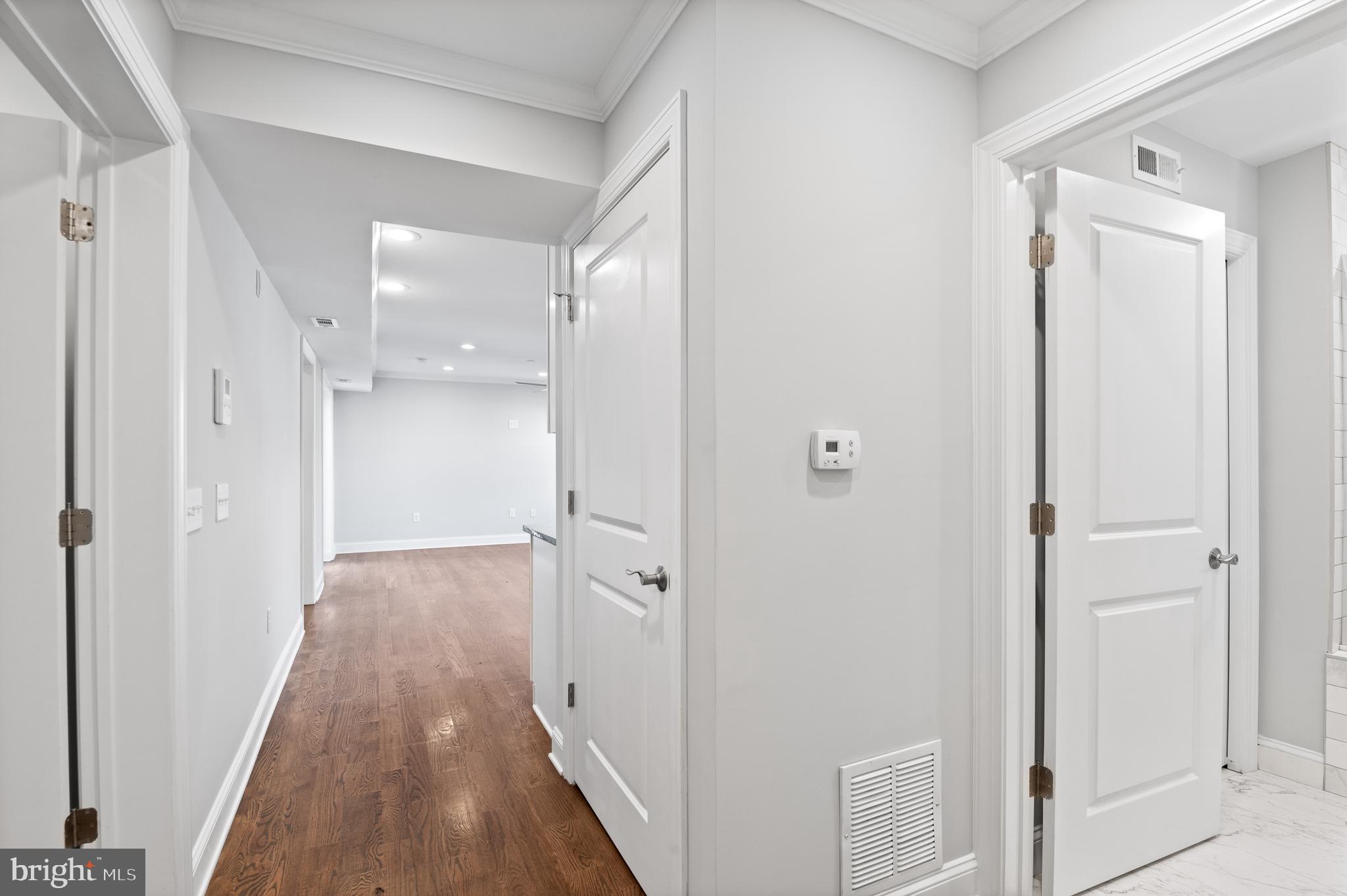 988 North Marshall Street, Unit 2R Philadelphia, PA 19123 - Photo 16 of 29 wooden floor with white walls