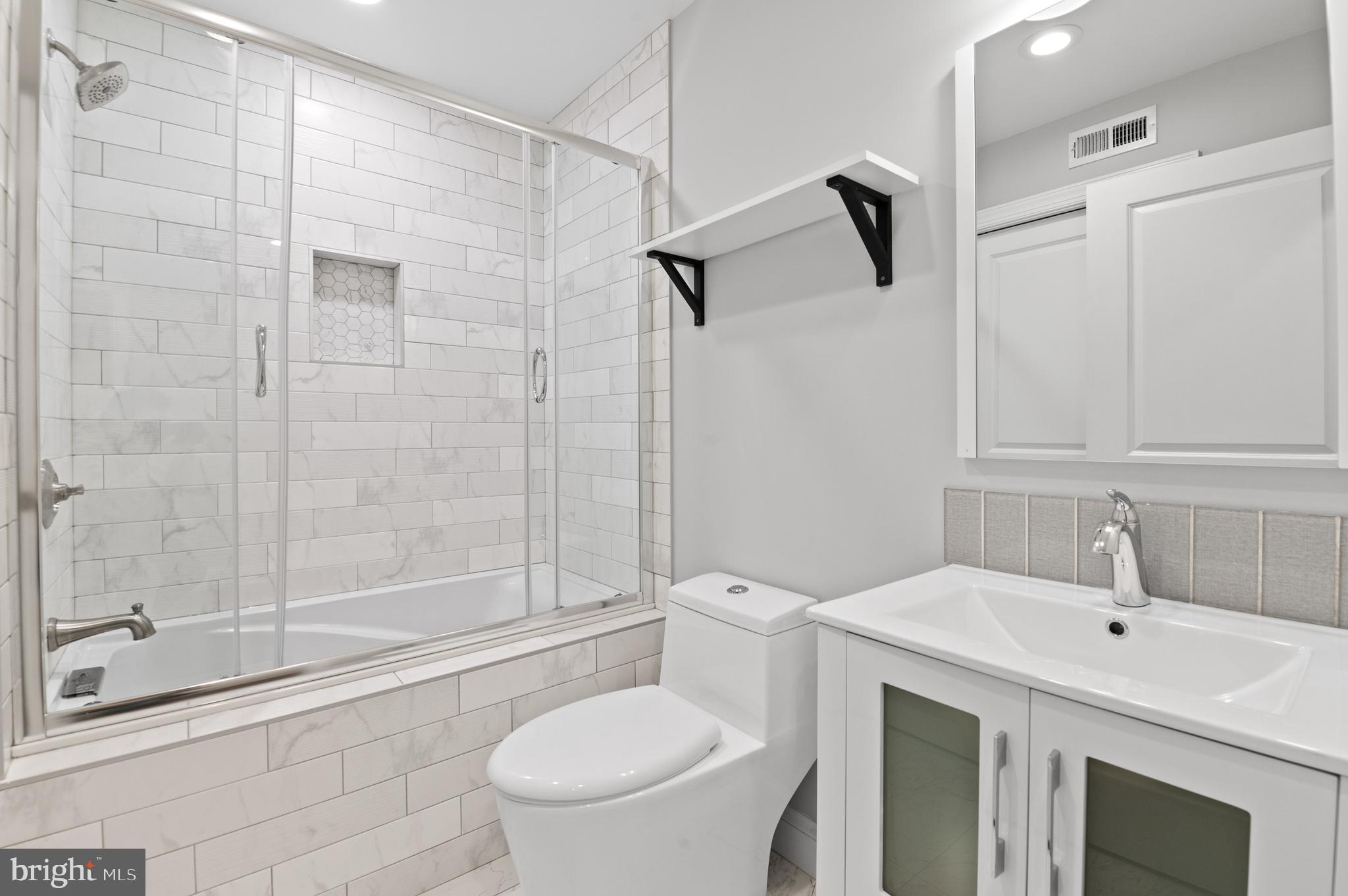 988 North Marshall Street, Unit 2R Philadelphia, PA 19123 - Photo 17 of 29 a bathroom with a sink toilet and shower