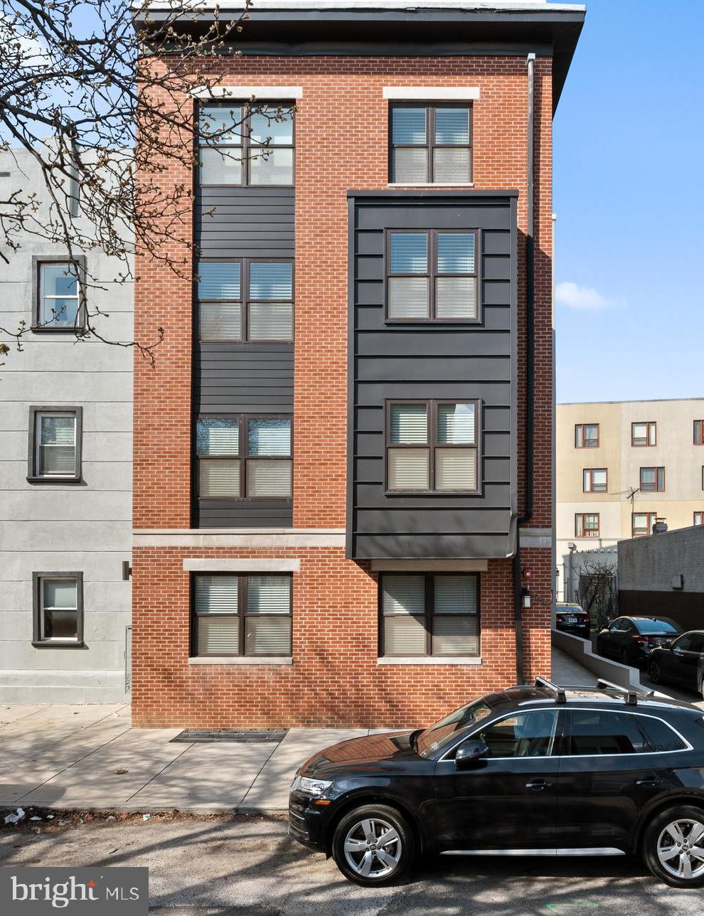 988 North Marshall Street, Unit 2R Philadelphia, PA 19123 - Photo 2 of 29 a front view of a house with a yard