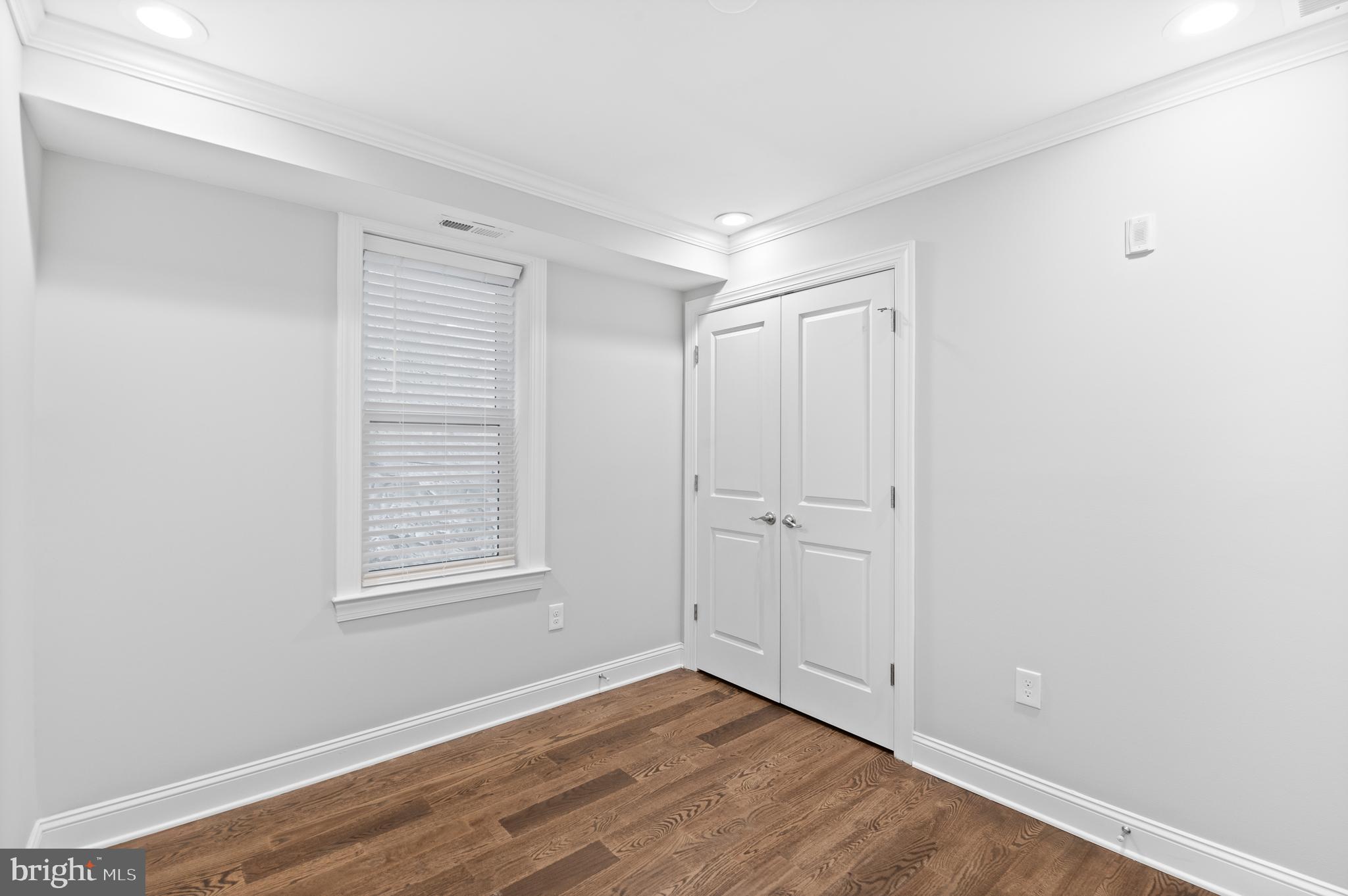 988 North Marshall Street, Unit 2R Philadelphia, PA 19123 - Photo 23 of 29 a view of an empty room with wooden floor and a window