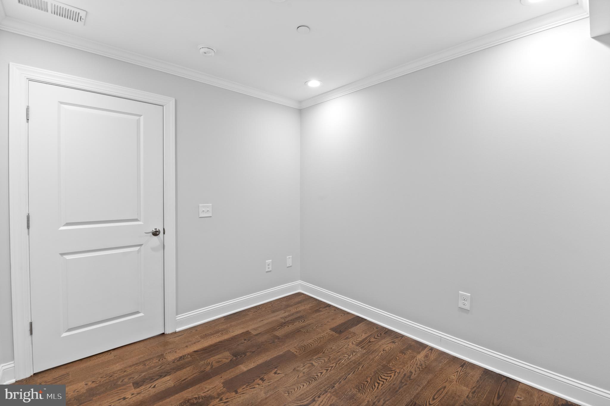 988 North Marshall Street, Unit 2R Philadelphia, PA 19123 - Photo 24 of 29 a view of an empty room with wooden floor