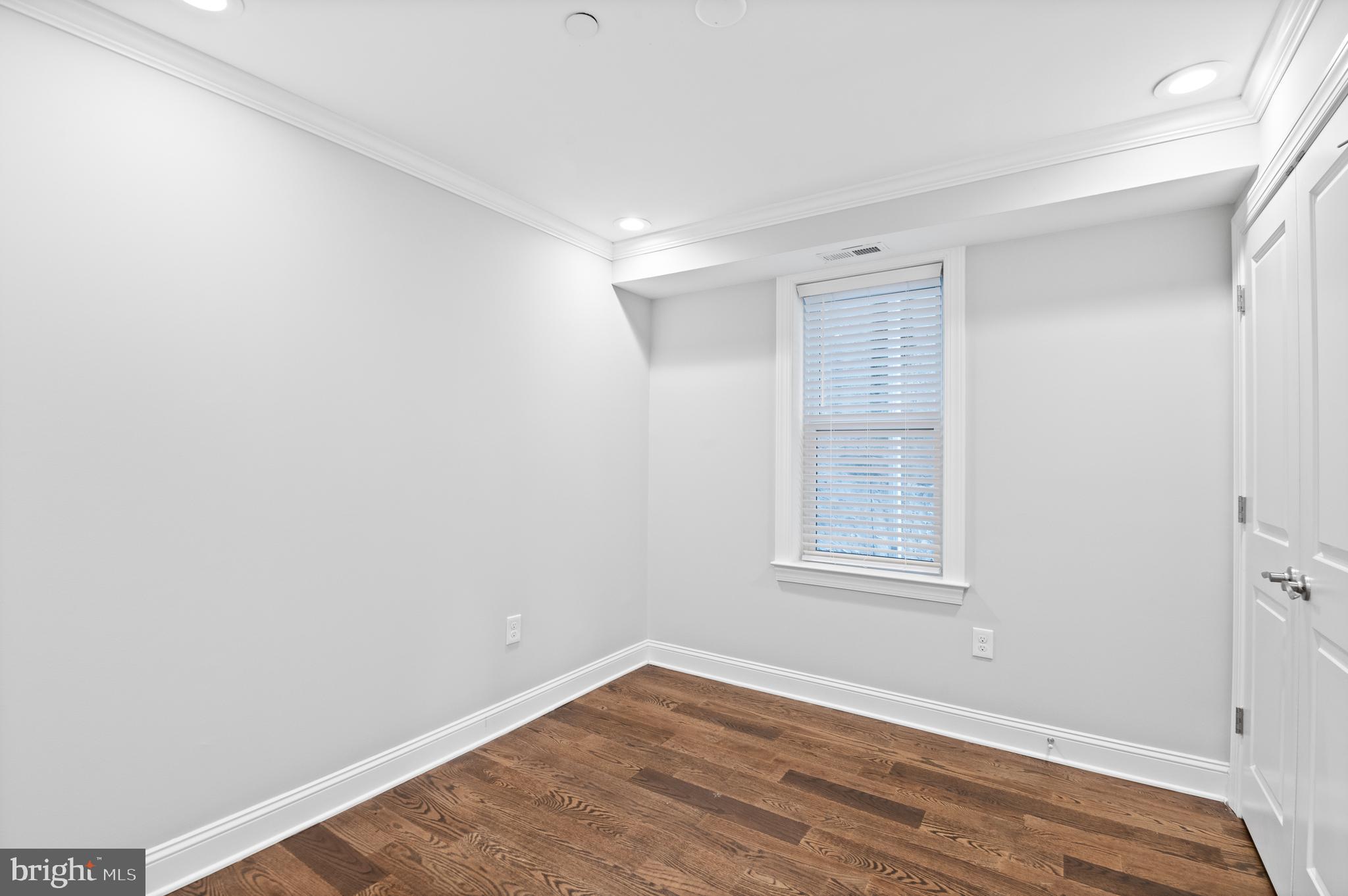 988 North Marshall Street, Unit 2R Philadelphia, PA 19123 - Photo 26 of 29 a view of an empty room with wooden floor and a window
