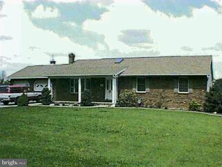 1100 Hoff Road Hanover, PA 17331 - Photo 1 of 6 a front view of a house with a garden