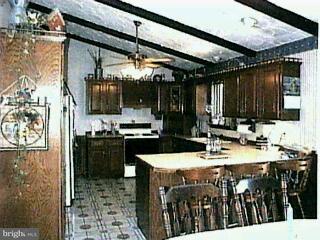 1100 Hoff Road Hanover, PA 17331 - Photo 2 of 6 a kitchen with a sink a stove and cabinets
