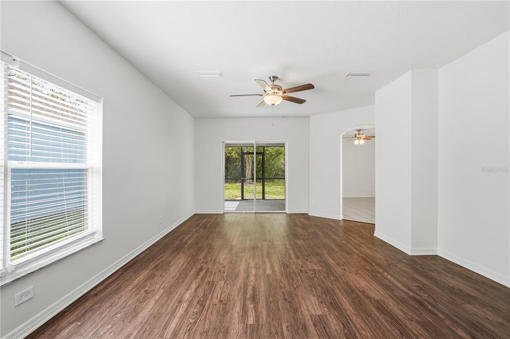 4155 Day Bridge Place Ellenton, FL 34222 - Photo 11 of 42 a view of empty room with wooden floor and fan