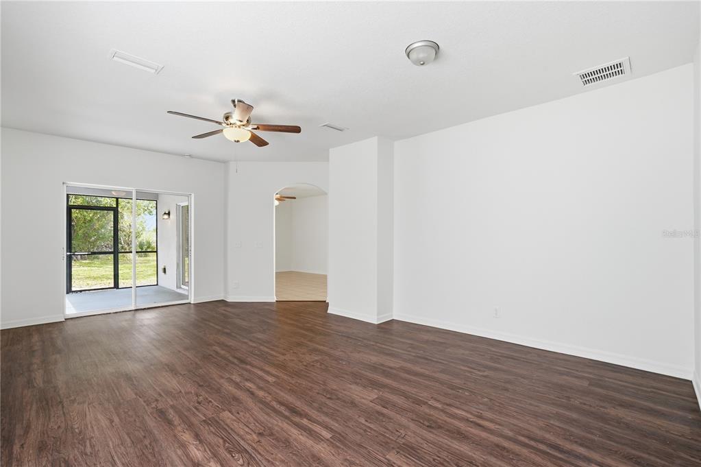 4155 Day Bridge Place Ellenton, FL 34222 - Photo 12 of 42 a view of an empty room with a window and wooden floor