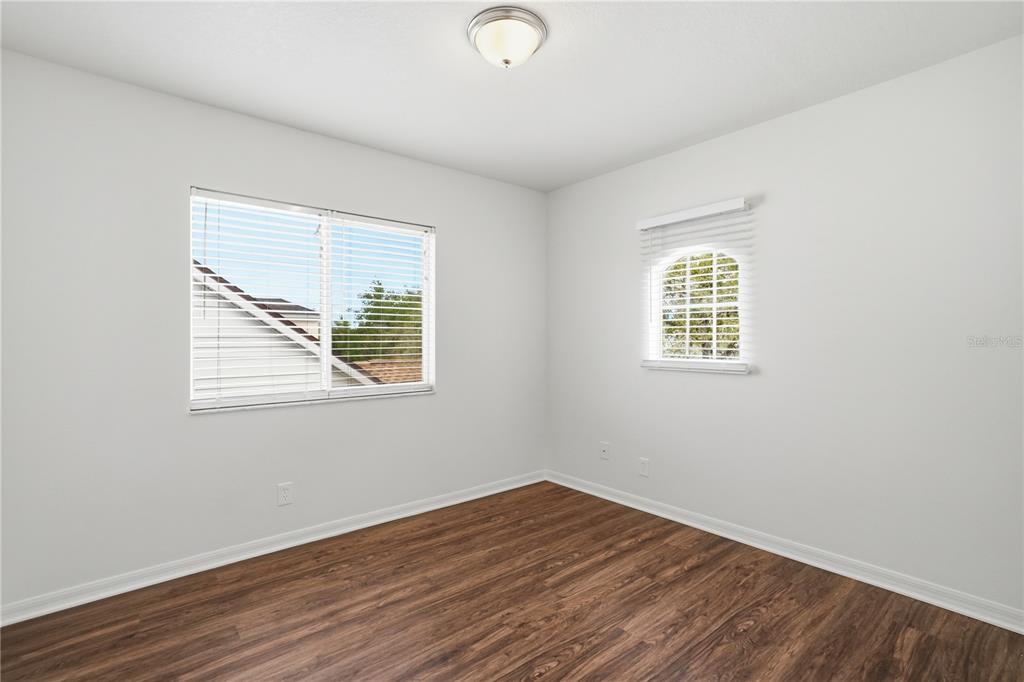 4155 Day Bridge Place Ellenton, FL 34222 - Photo 28 of 42 a view of an empty room with wooden floor and a window